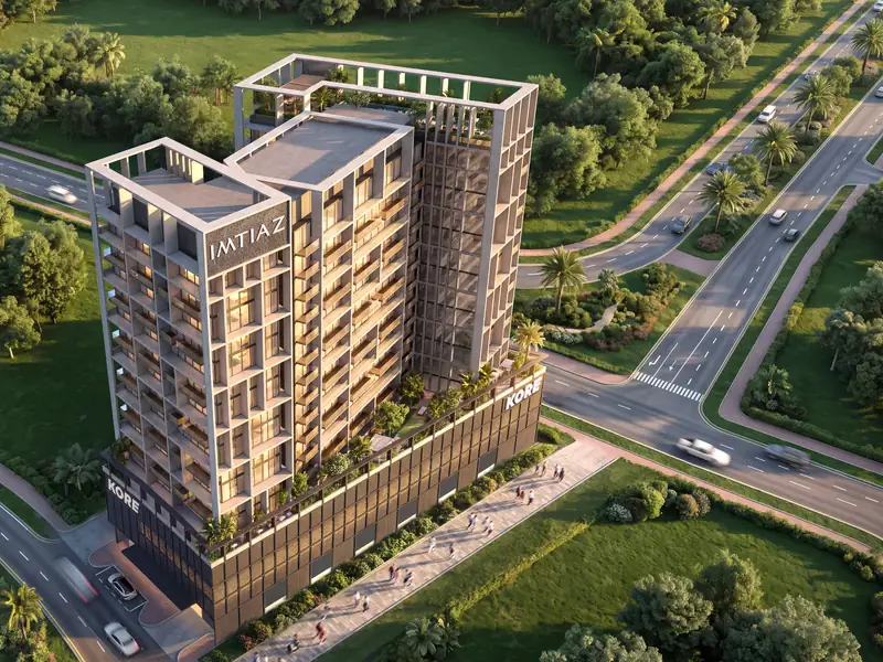 Aerial view of Kore by Imtiaz at a road junction, showing the rooftop pool level, podium garden and surrounding parkland